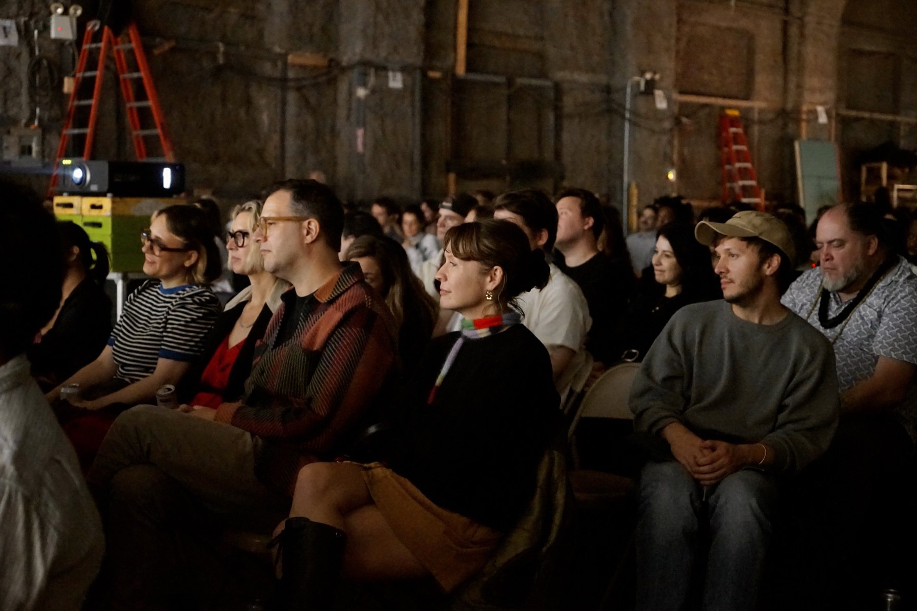 The Volume 1 audience watching the show in a Brooklyn warehouse